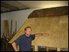 schlachter_pointing_his_thatched_roof.JPG